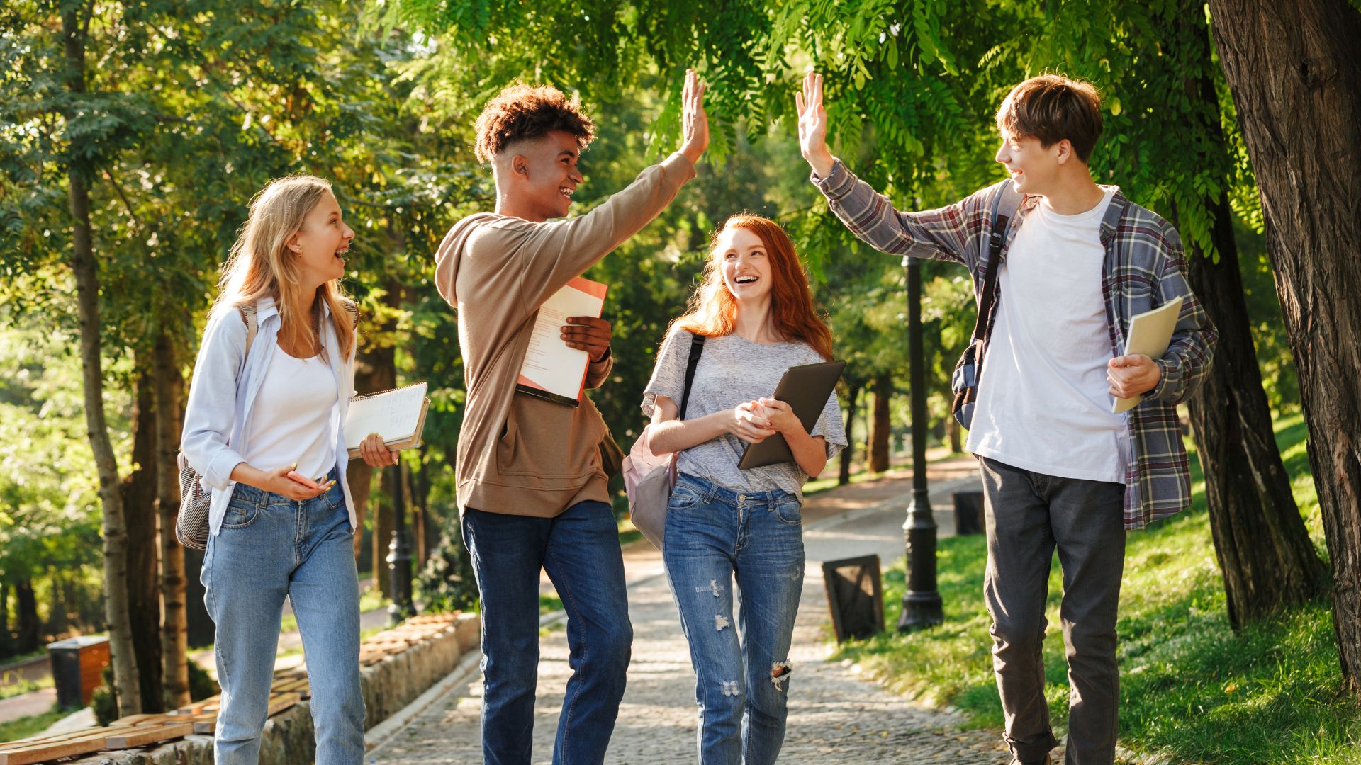 students high-fiving