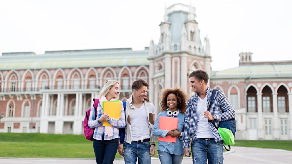 students walking in front of building