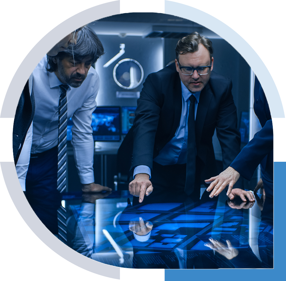 Executives bent over table