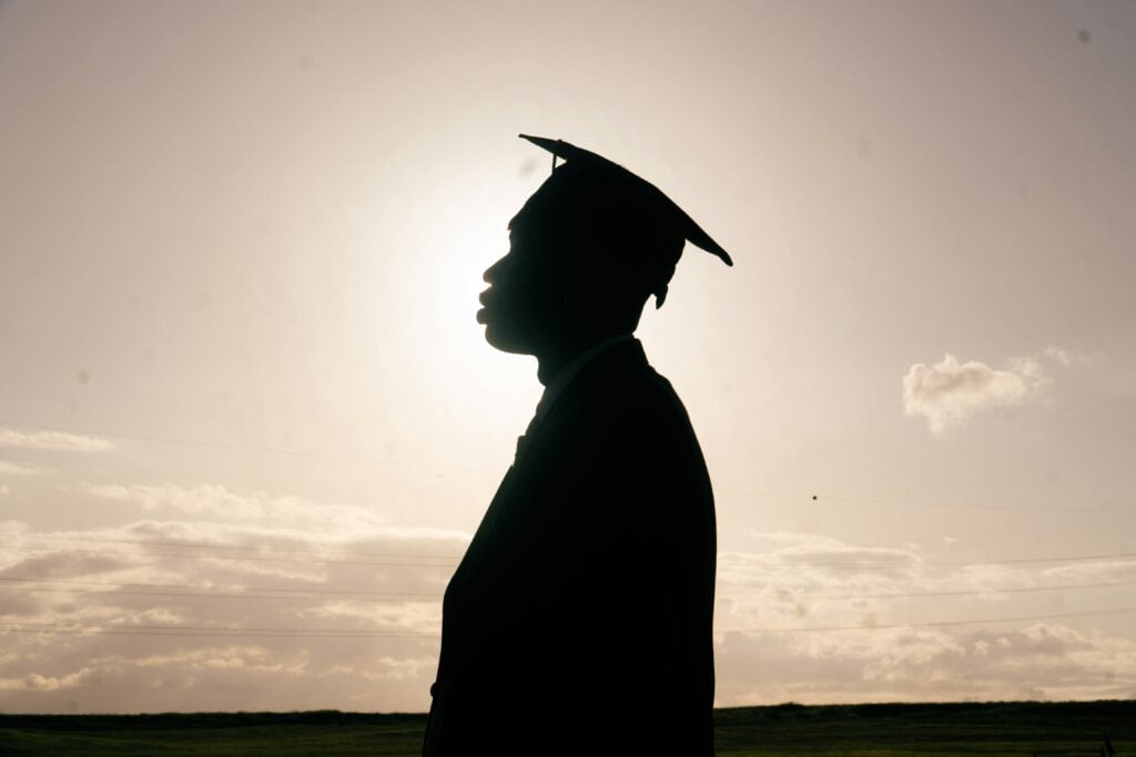 silhouette of student in grad cap