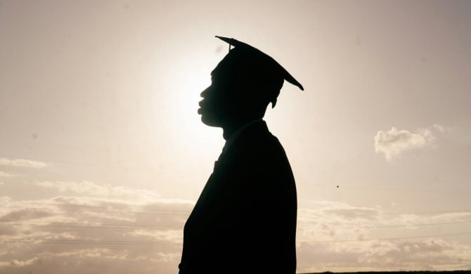 silhouette of student in grad cap