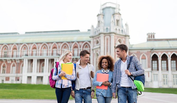 students walking in front of building